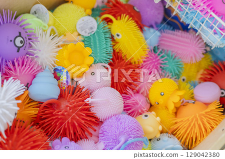 Colorful rubber toys for sale at the wagon sale Colorful rubber toys for sale at the wagon sale 129042380