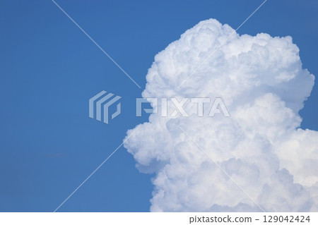 Vertically stretching cumulonimbus clouds Vertically stretching cumulonimbus clouds 129042424