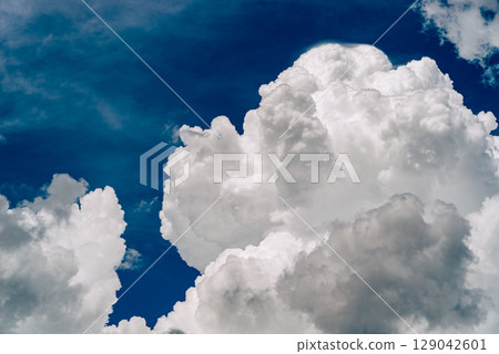 Summer sky with growing cumulonimbus clouds a-5 film style Summer sky with growing cumulonimbus clouds a-5 film style 129042601