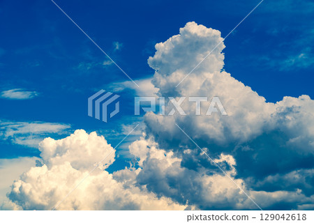 Summer sky with growing cumulonimbus clouds d-4 Emphasis on warm and cool colors Summer sky with growing cumulonimbus clouds d-4 Emphasis on warm and cool colors 129042618