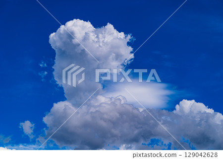 Summer sky with growing cumulonimbus clouds f-2 high saturation contrast Summer sky with growing cumulonimbus clouds f-2 high saturation contrast 129042628