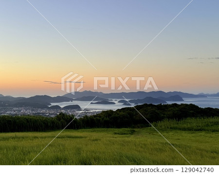 Evening view of Fukue from Mt. Onidake and the sea of the Goto Islands Evening view of Fukue from Mt. Onidake and the sea of the Goto Islands 129042740