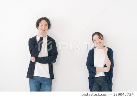 Male and female couple standing side by side Male and female couple standing side by side 129043724