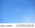 Airplane and blue sky seen from below 129043816