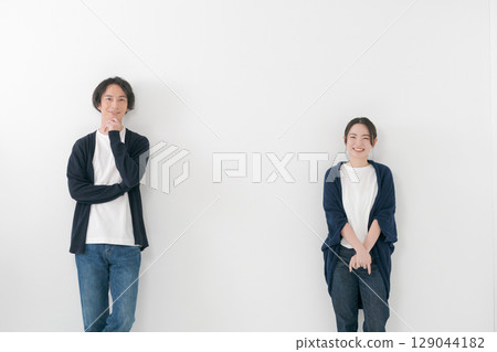 Male and female couple standing side by side 129044182