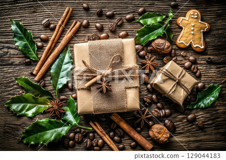A Beautiful Rustic Christmas Gift Arrangement Perfectly Displayed on a Wooden Table 129044183