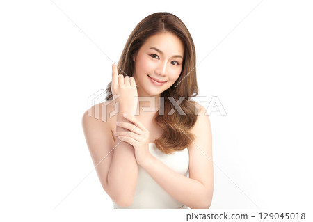 A beautiful young Asian woman with clean, fresh skin against a white background. Skincare, facial treatment, cosmetology, beauty, and spa. An elegant portrait of an Asian woman. A beautiful young Asian woman with clean, fresh skin against a white background. Skincare, facial treatment, cosmetology, beauty, and spa. An elegant portrait of an Asian woman. 129045018