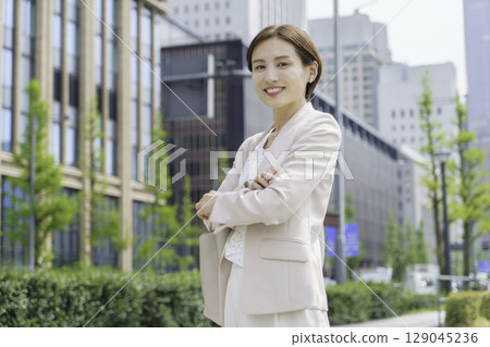 Portrait of a young businesswoman standing in an office district Portrait of a young businesswoman standing in an office district 129045236