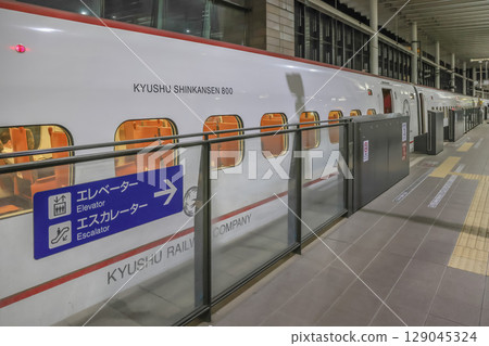 March 25 2025 Bullet Train at Nighttime Station Platform in Urban Setting, Japan March 25 2025 Bullet Train at Nighttime Station Platform in Urban Setting, Japan 129045324