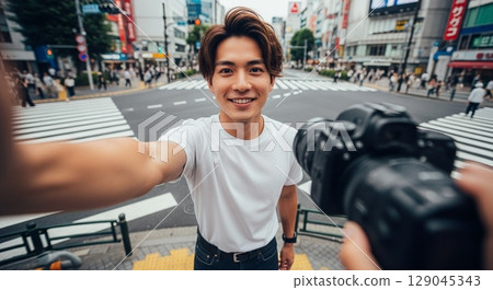 A man with a camera 129045343