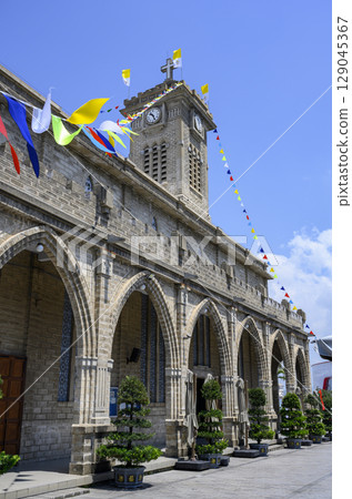 Clock tower in the Catholic Cathedral built in the 30s of the 20th century in Nha Trang, Vietnam 129045367