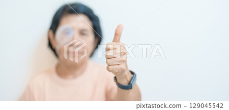 Elderly Woman with eye protective shield after eye surgery. Eye disease, Cataract,  Glaucoma, Age Related Macular Degeneration, Diabetic Retinopathy, Vitreous, Lasik, World Glaucoma day and health 129045542