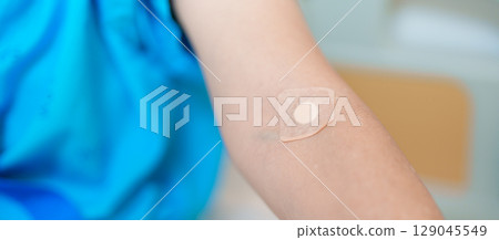Elderly asian Patient Woman with medical patch plaster after blood test in hospital. Diagnose, illness, treatment, Insurance, Healthcare, medical Examination, Blood donation and World Blood Donor Day 129045549