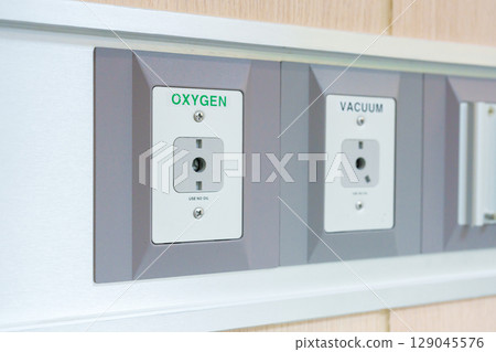 Oxygen and Vacuum Pipeline socket for Patient medical treatment in hospital room. Medical equipment, Emergency, Professional Medical system , Intensive Care Unit and Safety concept 129045576