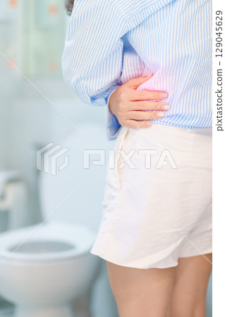 woman having abdomen pain or Stomachache in toilet due to Acute or Chronic Diarrhea from food poisoning digestion, constipation, Viral gastroenteritis, Celiac disease and  Malabsorption. Healthcare 129045629