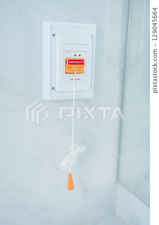 emergency button in toilet of hospital room, calling nurse in emergency case. Professional Medical system and Safety Alert emergency button in toilet of hospital room, calling nurse in emergency case. Professional Medical system and Safety Alert 129045664