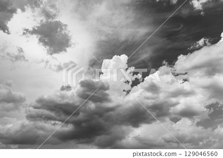 Summer sky with cumulonimbus clouds spreading b-6 monochrome 129046560