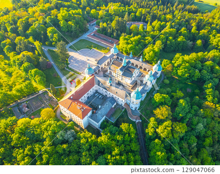Holy Mountain in Pribram features a stunning Baroque complex surrounded by lush greenery. This site serves as a significant pilgrimage destination in Czechia, attracting visitors year-round. Holy Mountain in Pribram features a stunning Baroque complex surrounded by lush greenery. This site serves as a significant pilgrimage destination in Czechia, attracting visitors year-round. 129047066
