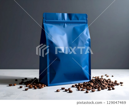 Assorted blue coffee bean bags on a black background with scattered roasted coffee beans Assorted blue coffee bean bags on a black background with scattered roasted coffee beans 129047469