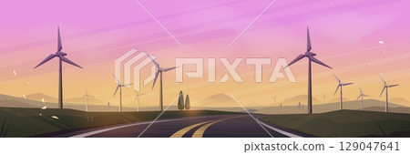 Wind turbines along empty road at sunset 129047641