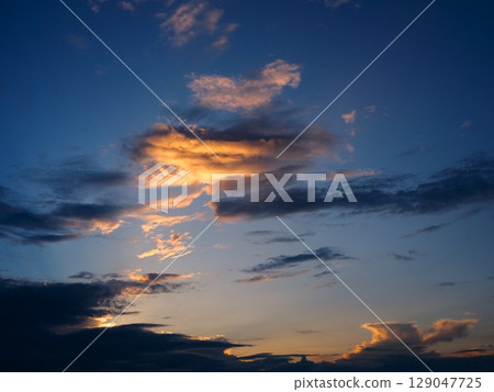 Beautiful orange sunset clouds 129047725