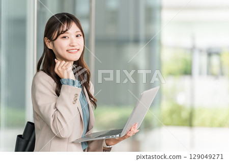 Stylish woman, designer, businesswoman with laptop (investment, side job, fist pump) 129049271