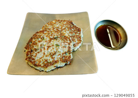 Traditional Korean Mung Bean Pancake Crispy Golden Brown with Soy Sauce isolated on transparent backgroud. Traditional Korean Mung Bean Pancake Crispy Golden Brown with Soy Sauce isolated on transparent backgroud. 129049855