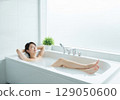 Woman relaxing in the bath Bath time 129050600