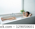 Woman relaxing in the bath Bath time 129050601