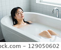 Woman relaxing in the bath Bath time 129050602