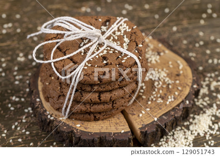 biscuits on the kitchen table, chocolate biscuits with real cocoa and sesame biscuits on the kitchen table, chocolate biscuits with real cocoa and sesame 129051743