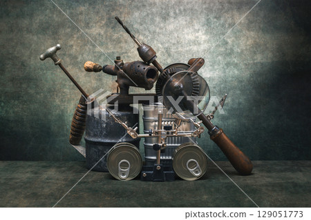Still life with blowtorch, drill and canned food 129051773