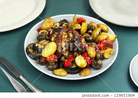 Baked or braised meat with vegetables. Baked or braised meat with vegetables. 129051904