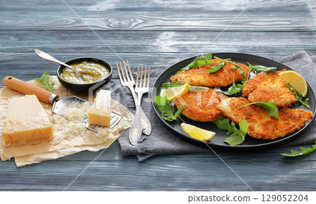 crispy parmesan crusted chicken cutlets, top view 129052204