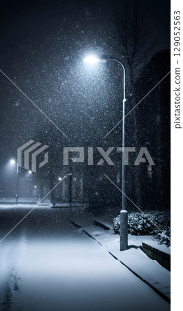 A snowstorm illuminated by streetlights 129052563