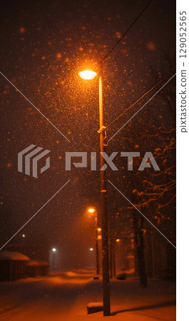 A snowstorm illuminated by streetlights 129052565