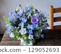 Blue flower arrangement on the table 129052693
