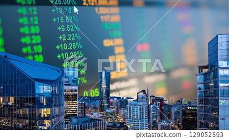 businessman hand writing on paper with graph chart and pen on city background with city buildings, s businessman hand writing on paper with graph chart and pen on city background with city buildings, s 129052893
