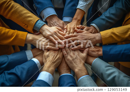 Diverse Business Team Joining Hands in Unity 129053149