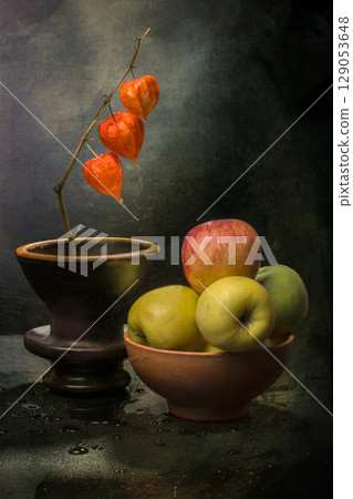 Still life with ripe apples and a branch of physalis Still life with ripe apples and a branch of physalis 129053648