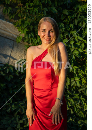 Beautiful Blonde Woman In Red Dress Laughing Smiling 129053999