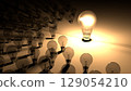 Lightbulbs placed around the glowing light bulb. The big lighbulb is glowing surounded by small lightbulbs, which are dead and shutdown. Representation of big energy consuption of bulbs 129054210