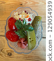 Fresh and colorful pickled vegetables served in a glass dish 129054939