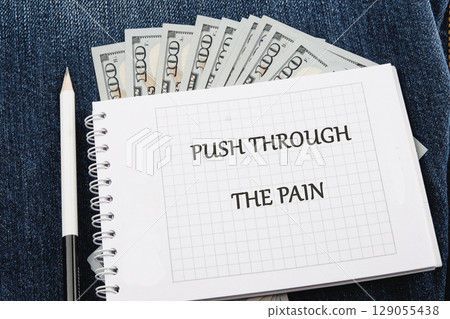 Despite discomfort concept. Words PUSH THROUGH THE PAIN Despite discomfort concept. Words PUSH THROUGH THE PAIN 129055438