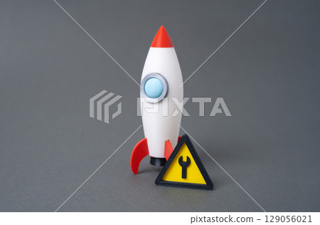 Rocket and repair sign. Startup in progress. Product under testing. Investor feedback processing. 129056021