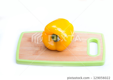 yellow paprika on wooden board yellow paprika on wooden board 129056022