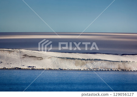 Arctic Islands Glaciers, snowfields, iceberg and rock outcrops 129056127