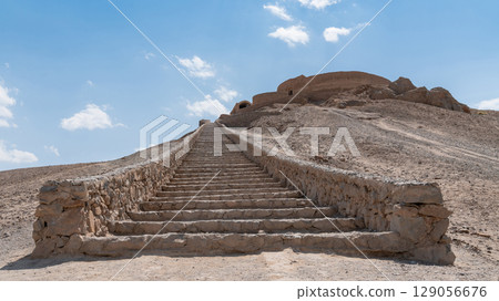 Ancient Zoroastrian Towers of Silence in Yazd, elevated circular structures on arid hills, under a vast sky 129056676