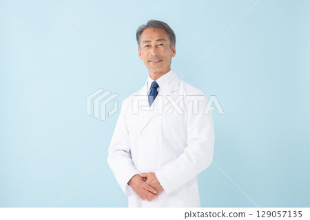 Medical image: Man in white coat, blue background 129057135