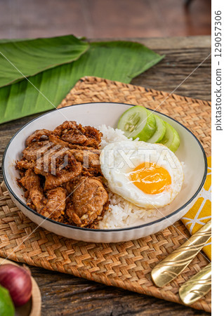 The Stir fried garlic pepper pork and fried egg  image for  Thai food concept. 129057306